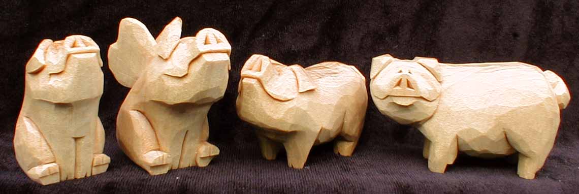 four pigs carving